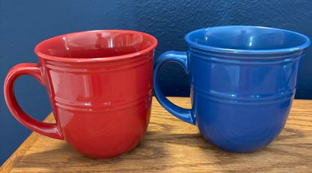 Two mugs, one solid red and one solid blue