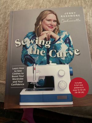the cover of the book Sewing the Curve by Jenny Rushmore, showing a smiling plus sized white woman and a sewing machine
